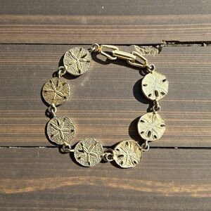 Stunning Gold-Plated Sand Dollar Bracelet – Like New